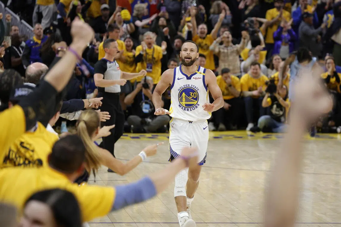 Golden State Warriors guard Stephen Curry celebrates scoring a three pointer during the second half of an NBA Play-In Tournament game against the Memphis Grizzlies.