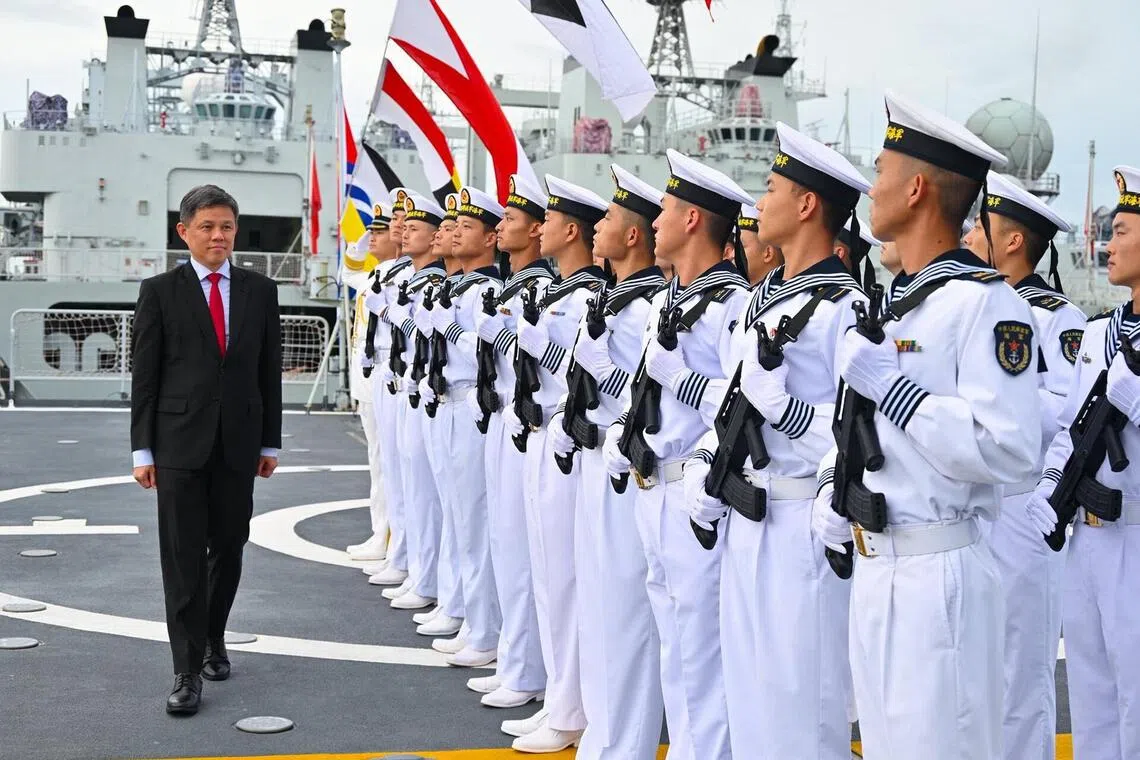 Minister for Defence Mr Chan Chun Sing Inspecting the Guard of Honour on board the Luyang III-class destroyer (Zhanjiang) during his introductory visit to China.