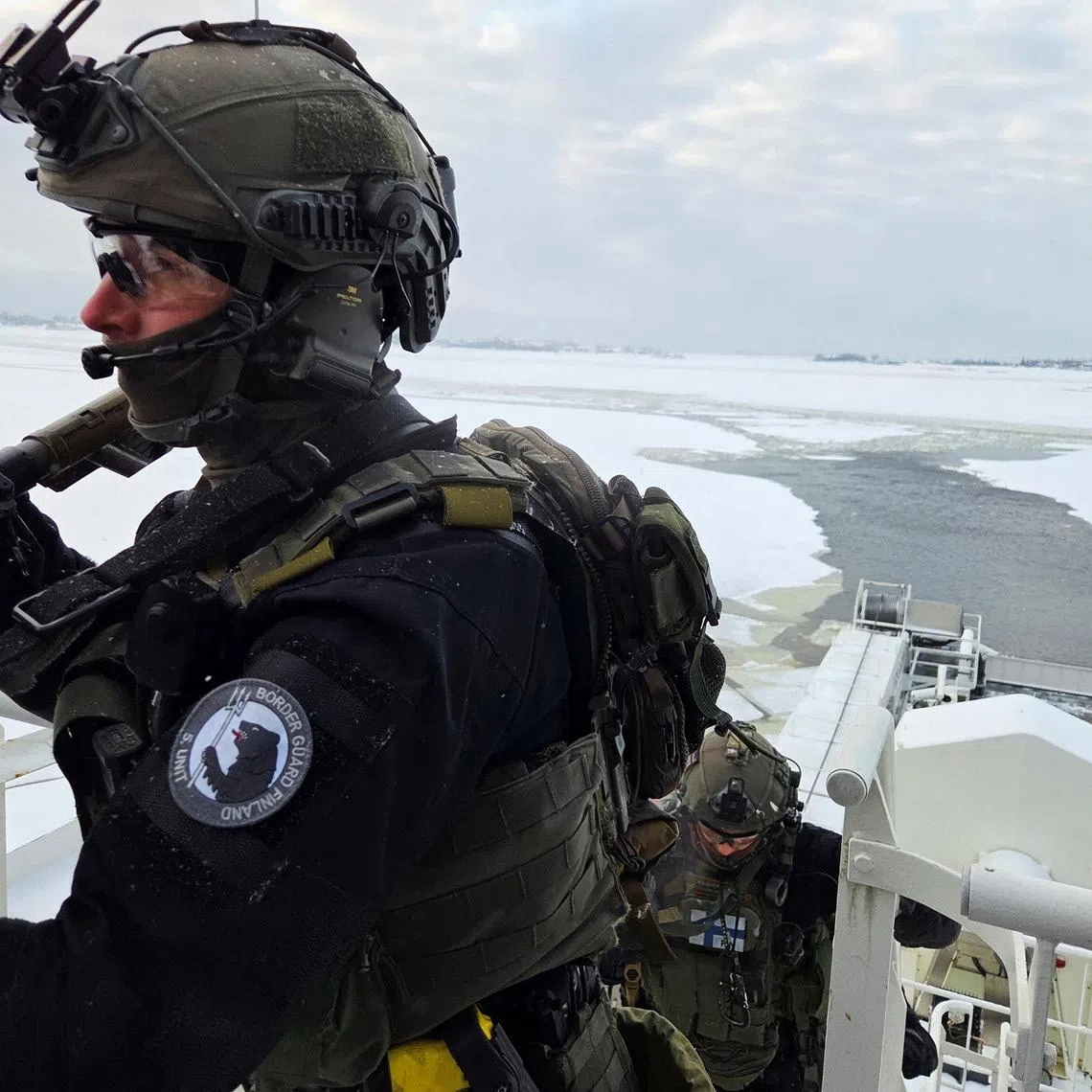 A member of the Finnish Border Guard's Special Intervention Unit takes part in an exercise on an offshore patrol vessel, Turva, near Helsinki on the Baltic Sea, Finland, January 26, 2026. Picture taken with a mobile phone. REUTERS/Anne Kauranen