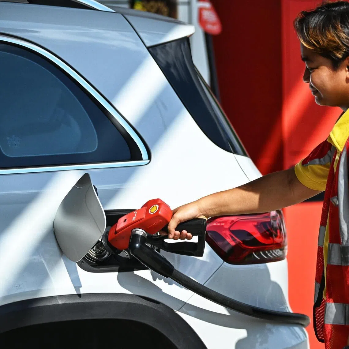 Generic photo of a pump attendant fueling a car at Shell Lakeview petrol station on August 7, 2023. Can be used for petrol price , energy, gas stories.