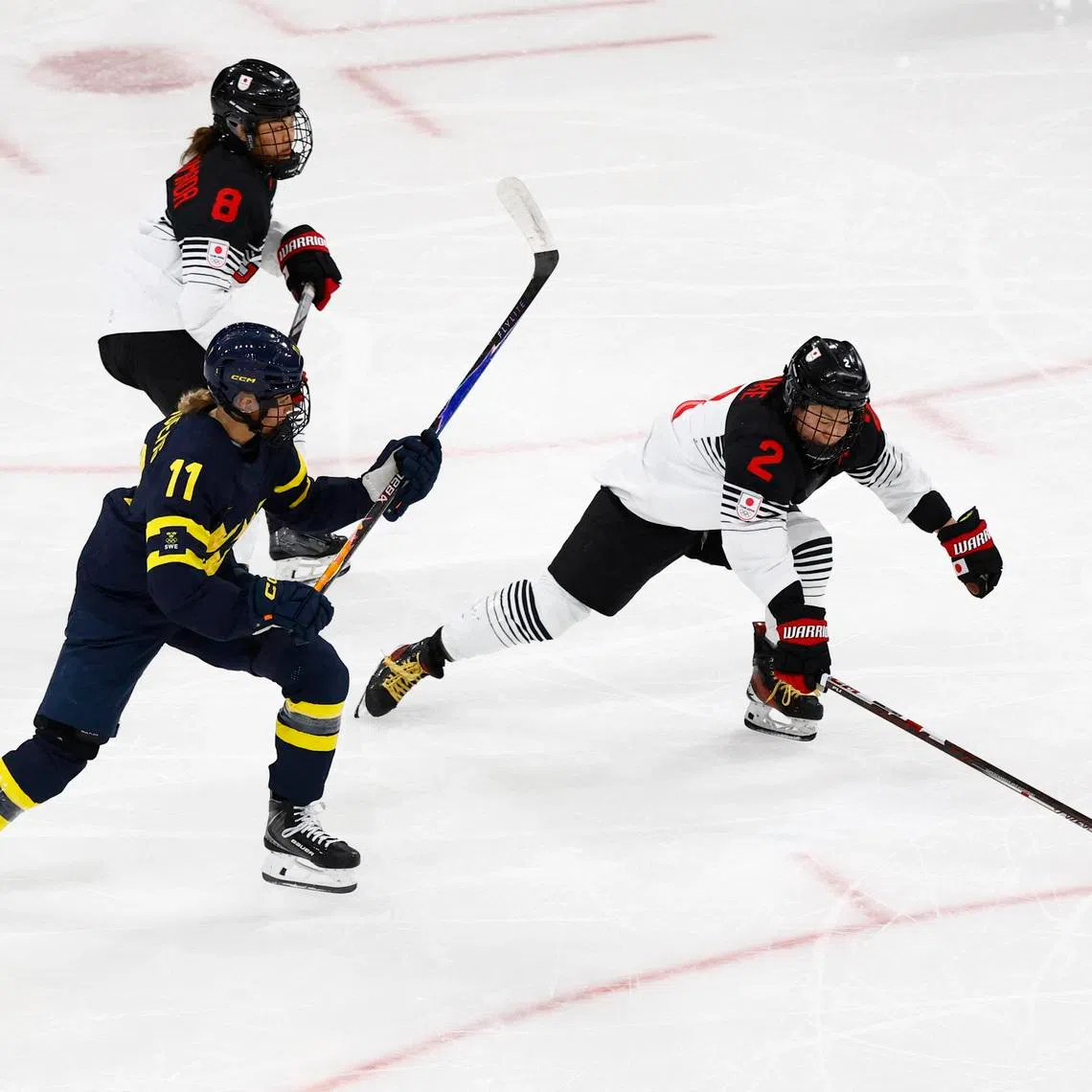 Milano Cortina 2026 Olympics - Ice Hockey - Women's Preliminary Round - Group B - Japan vs Sweden - Milano Rho Ice Hockey Arena, Milan, Italy - February 10, 2026. Shiori Koike of Japan in action with Josefin Bouveng of Sweden REUTERS/Alessandro Garofalo