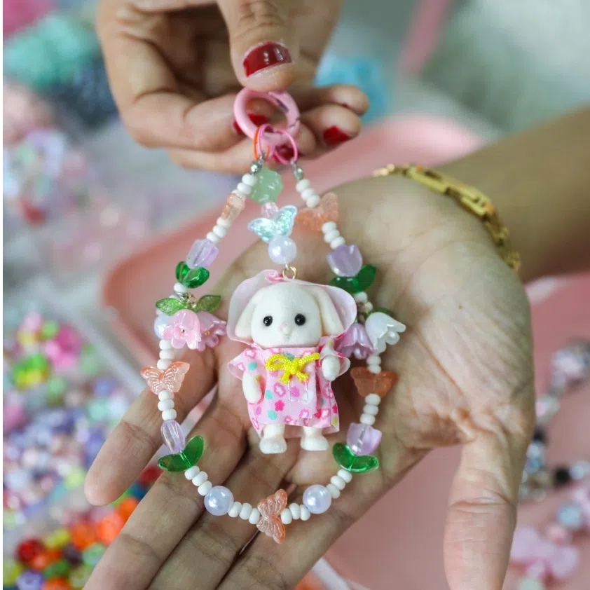 Accessorising one’s purse with bag charms has become the de facto way to express identity and personal style.