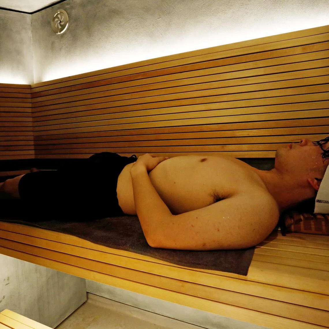 Kotaro Nakahira, a staff member of Solo Sauna Tune, uses its private Finnish-style sauna room during a demonstration, amid the coronavirus disease (COVID-19) outbreak, in Tokyo, Japan, December 10, 2020. REUTERS/Kim Kyung-Hoon