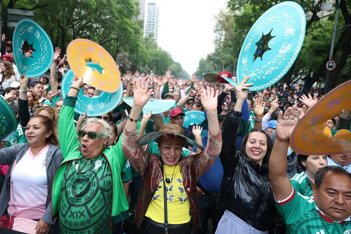 People participate in an attempt to break the Guinness World Record for the world’s largest “Mexican wave” along Reforma Avenue as part of activities ahead of the FIFA World Cup 2026, in Mexico City, Mexico, June 6, 2026. REUTERS/Luis Cortes