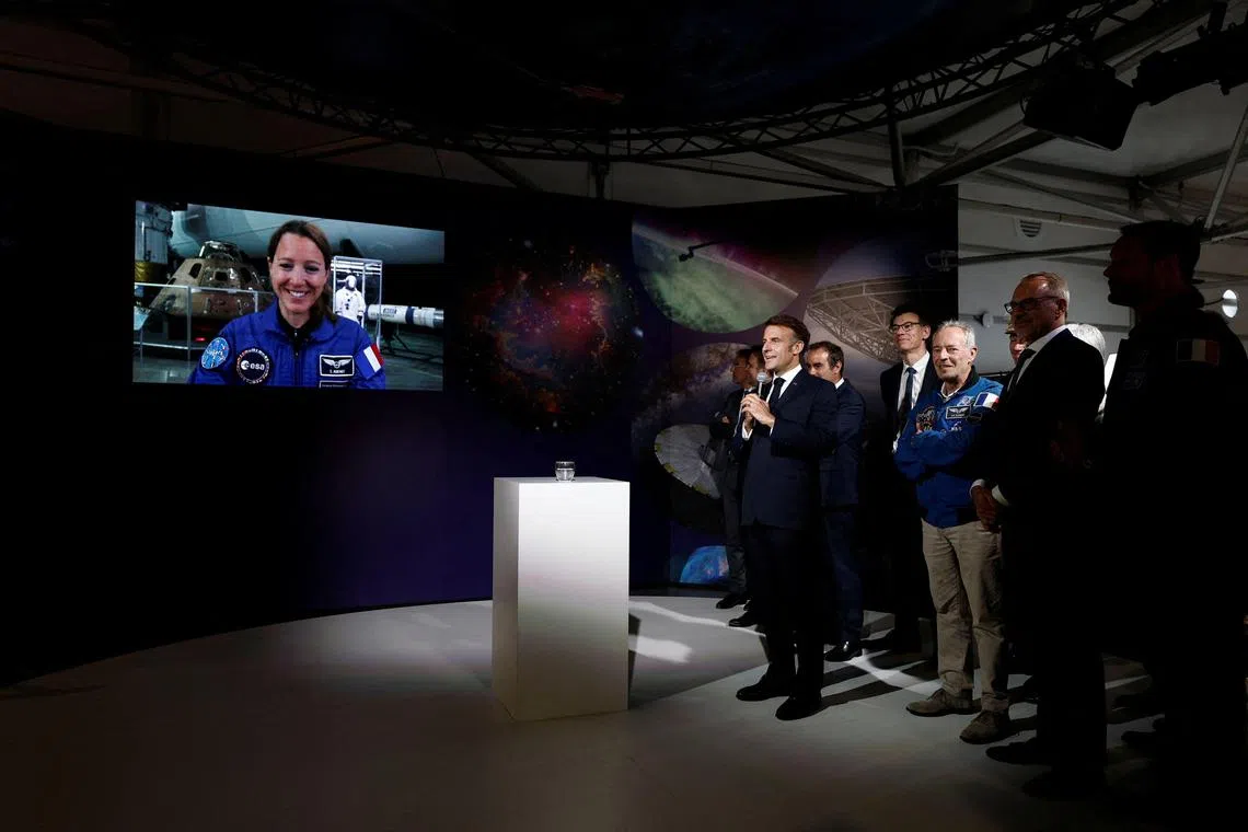 French President Emmanuel Macron speaks with French astronaut Sophie Adenot, who is set to join the ISS crew in 2026.