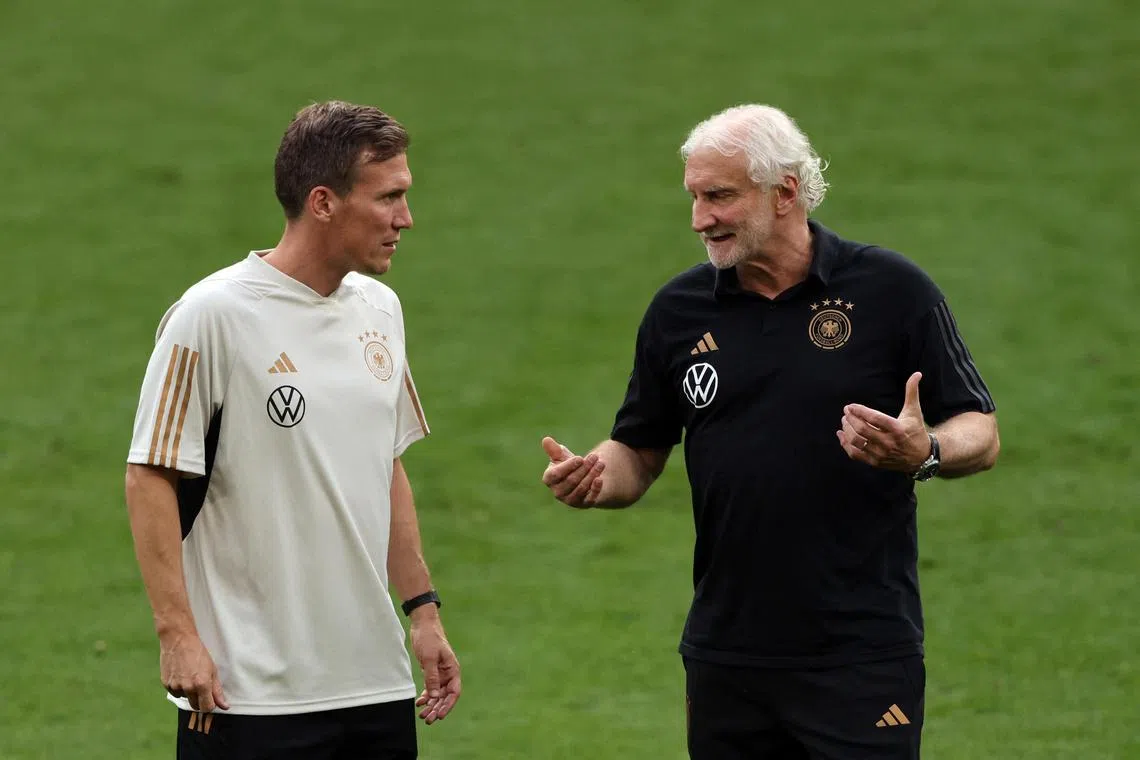 Germany interim coach Rudi Voller (right) with assistant coach Hannes Wolf during training.