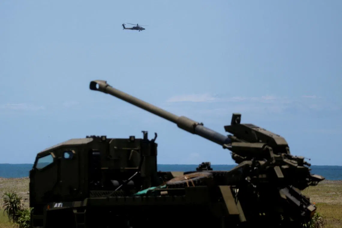 FILE PHOTO: An Apache helicopter flies by during the annual joint military exercises between the U.S. and Philippine troops called \"Balikatan\" or shoulder-to-shoulder, in Aparri, Cagayan province, Philippines, May 3, 2025. REUTERS/Lisa Marie David/File Photo