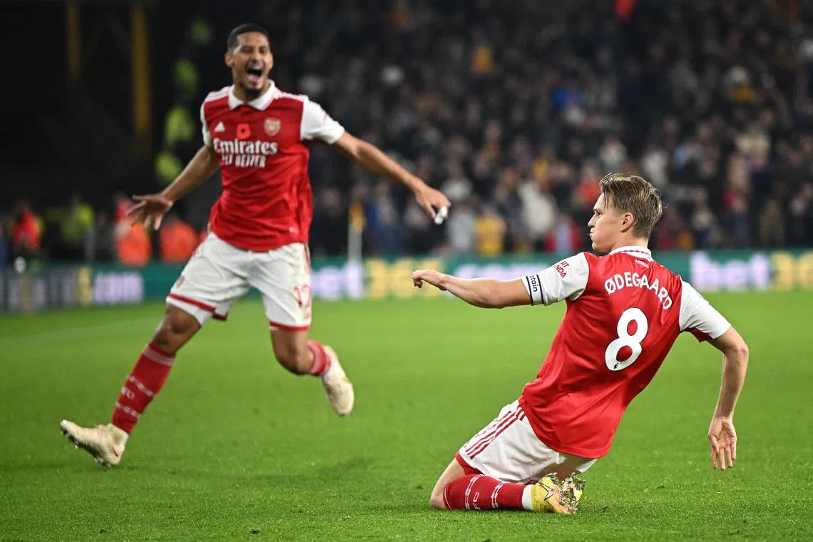 Arsenal's Martin Odegaard celebrates scoring his team's second goal during the 2-0 Premier League win at Wolverhampton Wanderers on Nov 12, 2022.