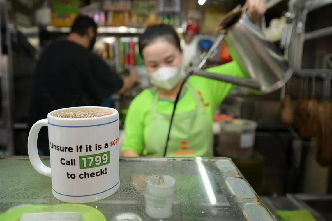 960 cups featuring the ScamShield helpline (1799) have been launched since Oct 5, 2024, at Boon Lay Hawker Centre in a pilot program to raise awareness about scams.