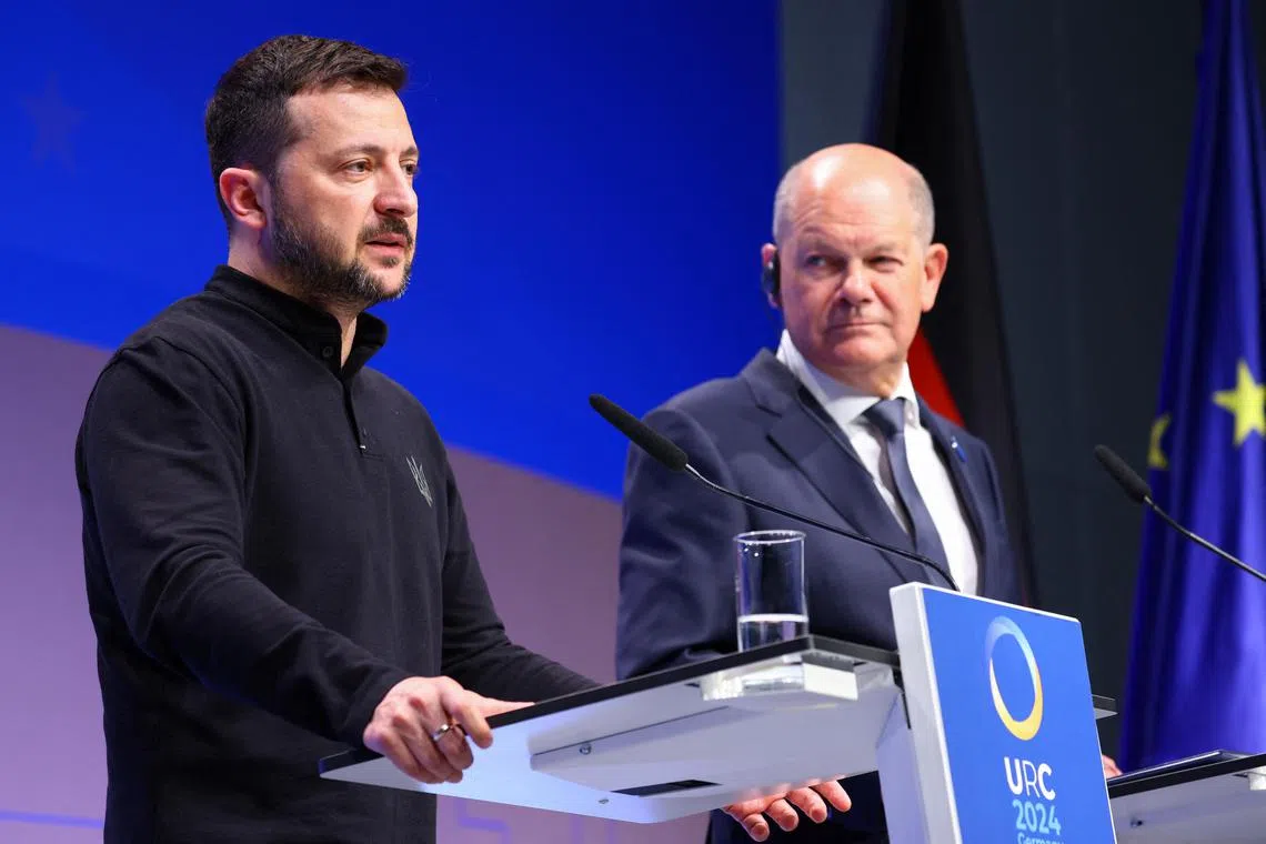 Ukrainian President Volodymyr Zelensky speaking to the press, next to German Chancellor Olaf Scholz, at the Ukraine Recovery Conference in Germany, on June 11.