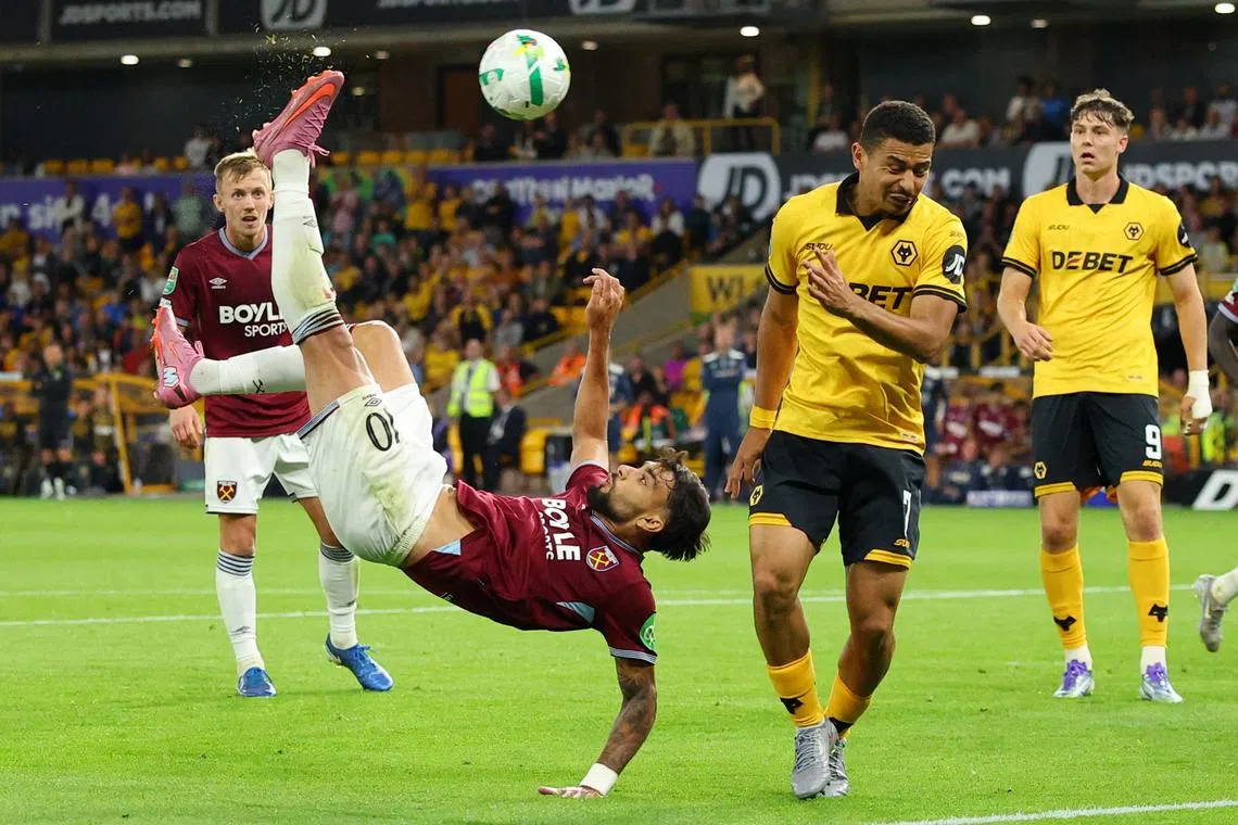 Soccer Football - Carabao Cup - Second Round - Wolverhampton Wanderers v West Ham United - Molineux Stadium, Wolverhampton, Britain - August 26, 2025 West Ham United's Lucas Paqueta in action with Wolverhampton Wanderers' Andre Action Images via Reuters/Andrew Boyers