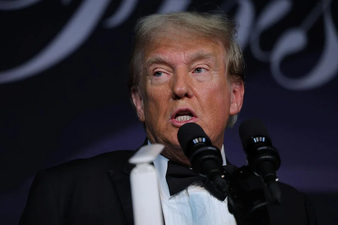 FILE PHOTO: U.S. President-elect Donald Trump speaks at the America First Policy Institute (AFPI) gala at Mar-A-Lago in Palm Beach, Florida, U.S., November 14, 2024. REUTERS/Carlos Barria/File Photo