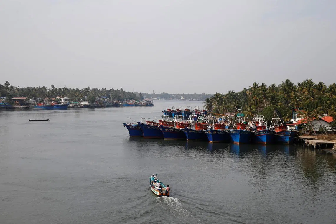 FILE PHOTO: Fishermen travel in a boat in the tributary waters of the Periyar River at Munambam on the outskirts of Kochi in the southern state of Kerala, India, January 21, 2019. REUTERS/Sivaram V/File Photo