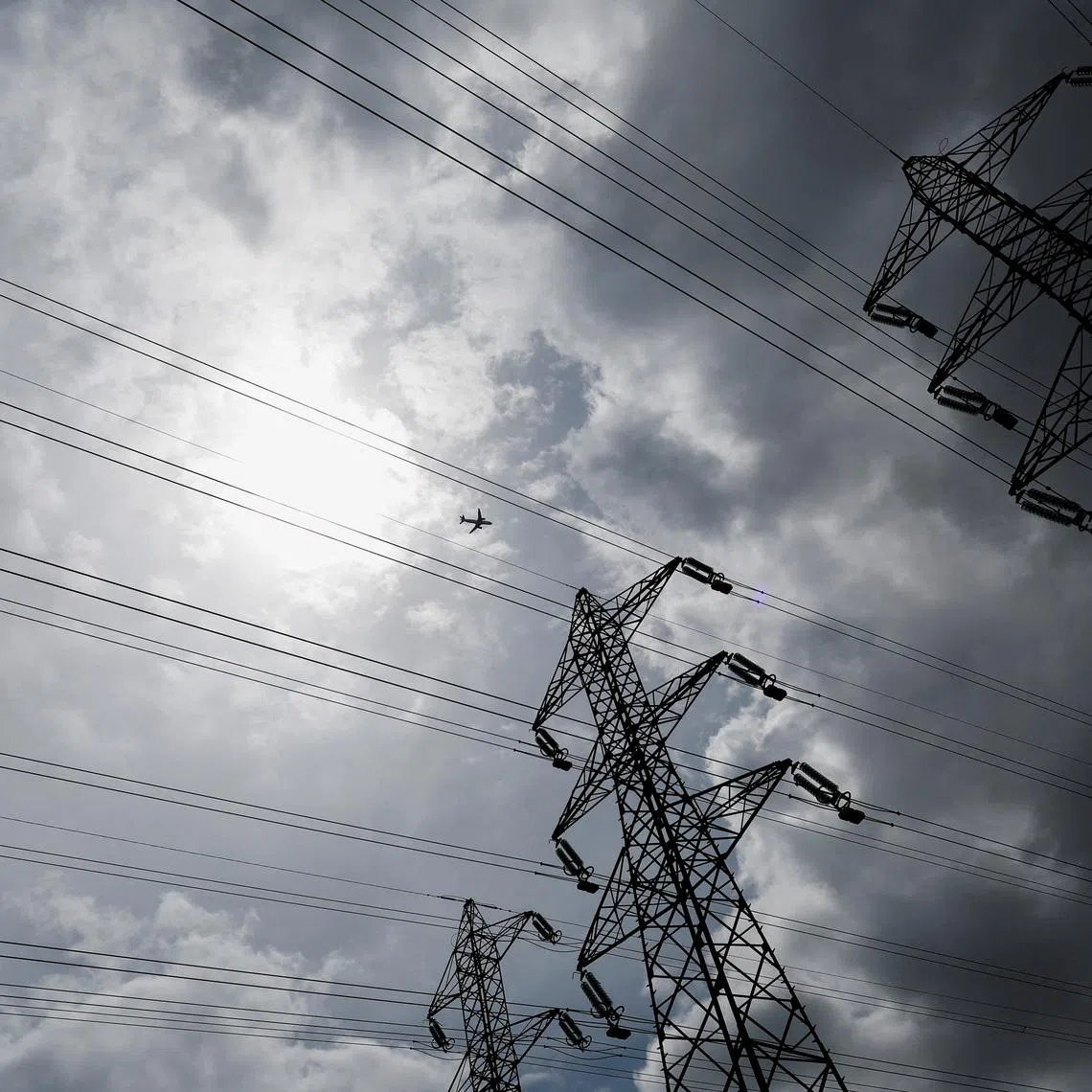 Electricity transmission pylons can be seen near TGV high-speed train tracks in Villebon-sur-Yvette, near Paris, France, August 1, 2022. REUTERS/Benoit Tessier REFILE - CORRECTING DATE