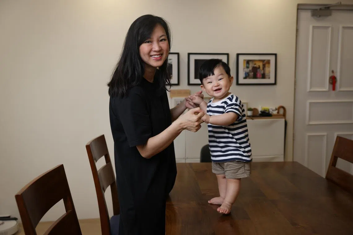 Ms Sarah Toh from DBS enjoyed a six-month work from home stint in addition to her maternity leave. She treasures the extra time she has had with her eight-month-old son, Dylan Yee. ST PHOTO: ONG WEE JIN