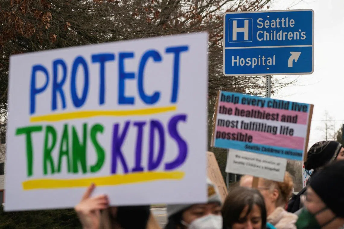 FILE PHOTO: Demonstrators gather for a rally in support of trans youth at Seattle Children's hospital, following U.S. President Donald Trump's executive order that denies federal funding for pediatric gender-affirming care, in Seattle, Washington, U.S. February 8, 2025. REUTERS/David Ryder/File Photo