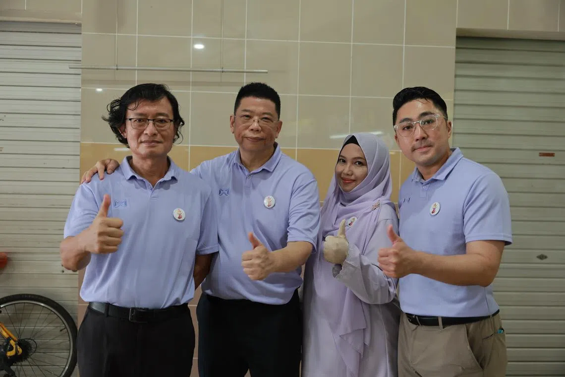 (From left) Mr Martinn Ho, Mr Peter Soh, Mdm Arbaah Haroun and Mr Derrick Sim after a walkabout at Tampines Round Market and Food Centre on April 12.