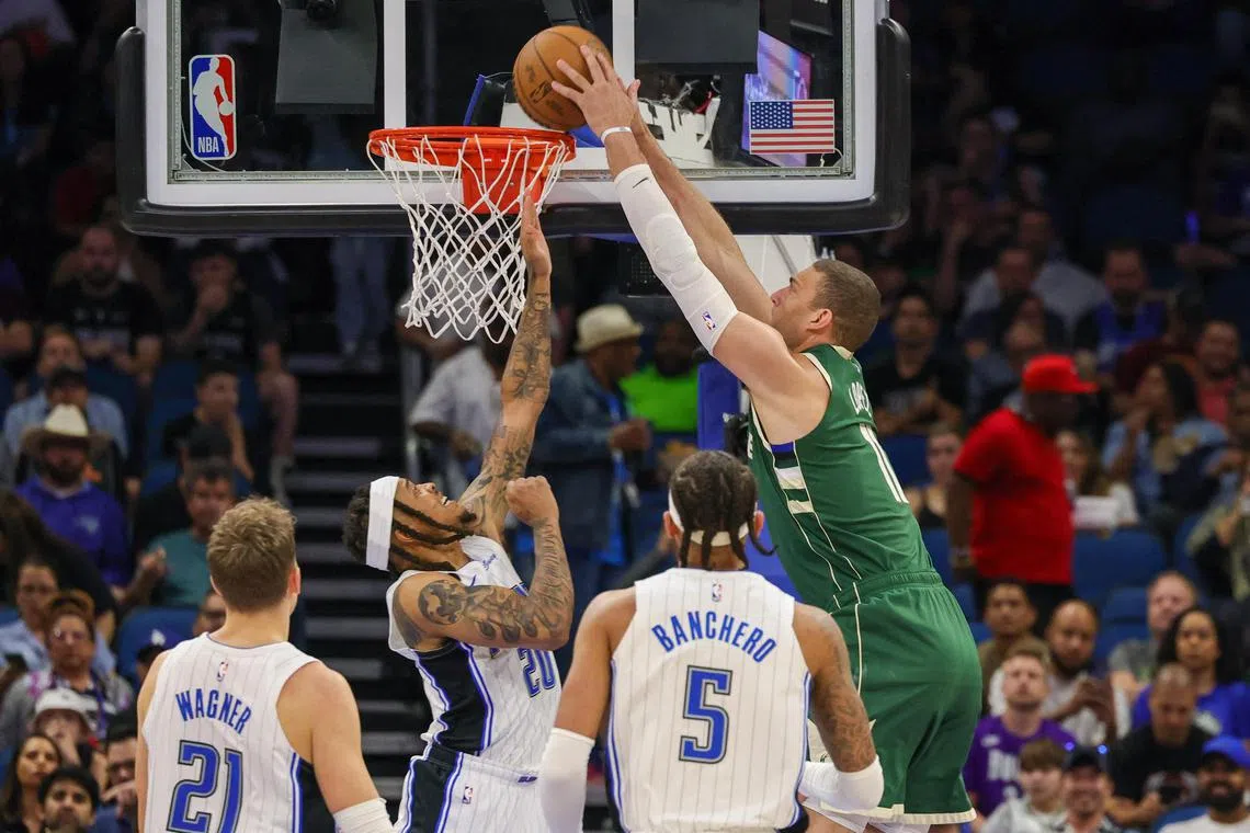 Milwaukee Bucks centre Brook Lopez dunks the ball against Orlando Magic guard Markelle Fultz during the first quarter at Amway Centre.