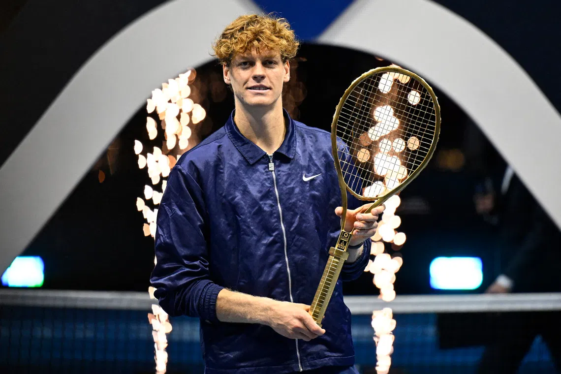 Tennis - Six Kings Slam - ANB Arena, Riyadh, Saudi Arabia - October 18, 2025 Italy's Jannik Sinner celebrates with a racket after winning the final against Spain's Carlos Alcaraz REUTERS/Stringer