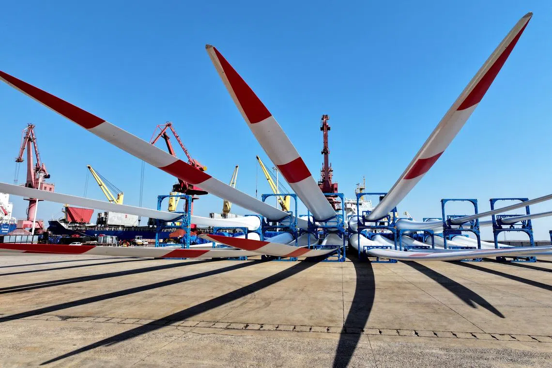 Goldwind wind turbine blades are seen on the dock waiting to be loaded onto a ship for export at the port in Lianyungang, in the eastern Jiangsu province of China, on March 17, 2025. 