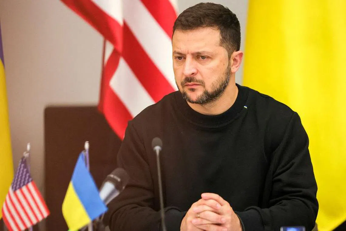 FILE PHOTO: Ukraine's President Volodymyr Zelenskiy addresses a meeting of the Ukraine Defense Contact Group ahead of a two-day NATO Defense Ministers Council at the alliance headquarters in Brussels, Belgium, October 11, 2023.  Olivier Matthys/Pool via REUTERS/File Photo