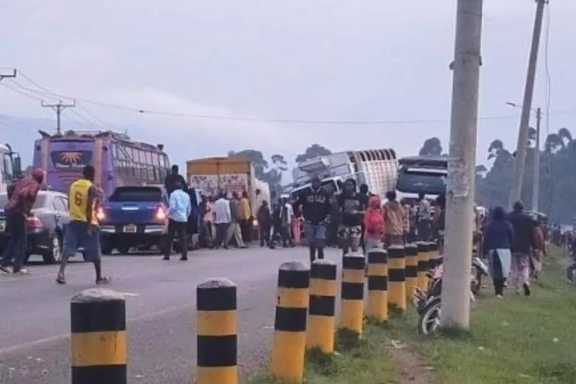 A lorry carrying a shipping container veered off the road, rammed more than six vehicles and ran over pedestrians. 
