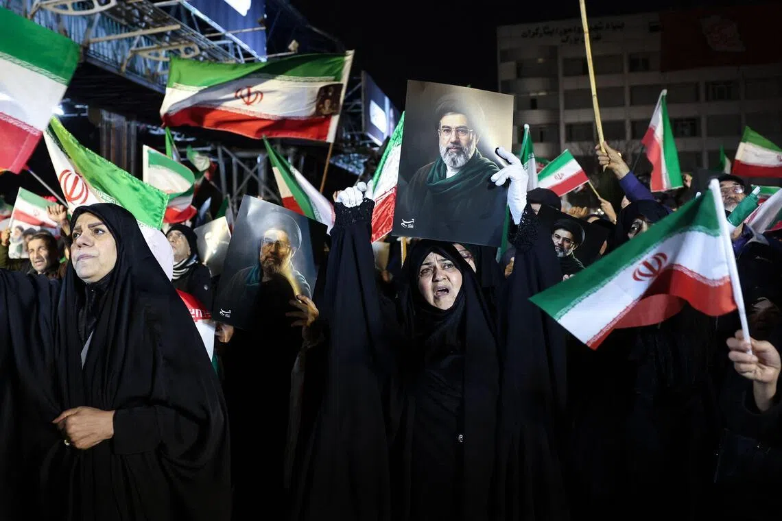 ‘I will take up arms’: US-Israeli war in Iran prompts surge of nationalism among Iranians