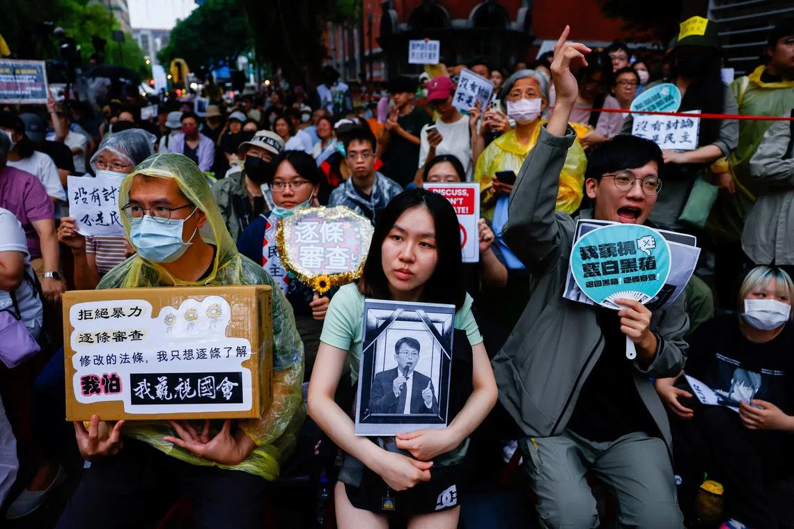 People gather outside while the Taiwanese parliament is in session, in Taipei, Taiwan May 24, 2024. REUTERS/Ann Wang