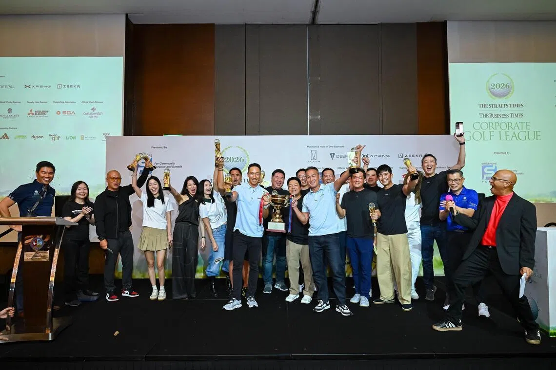 The Hugo Boss team, with captain Andre Huber (middle) holding the trophy, celebrating their victory in The Straits Times & Business Times Corporate Golf League at the Singapore Island Country Club on May 8.