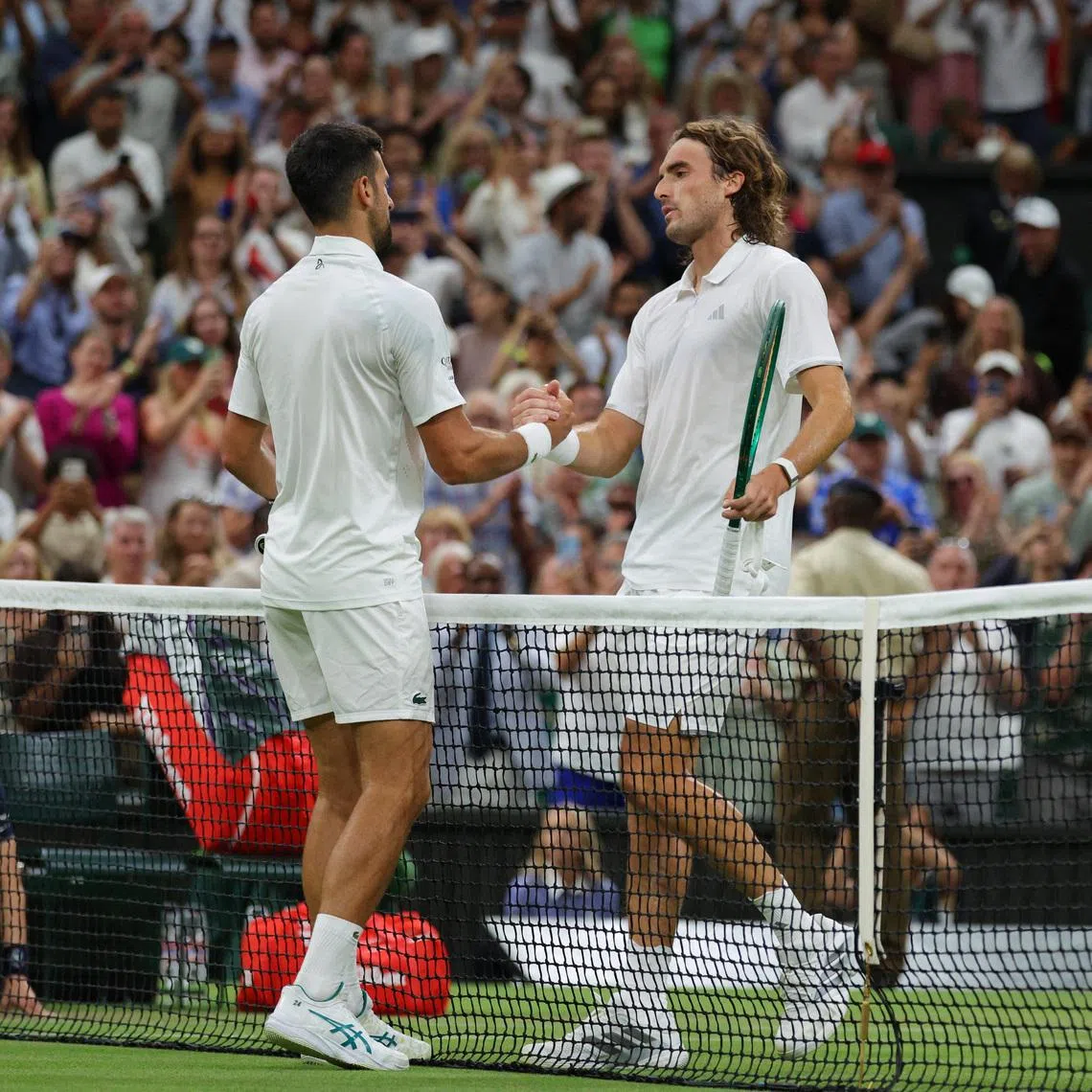Tennis - Wimbledon - All England Lawn Tennis and Croquet Club, London, Britain - July 1, 2026 Serbia's Novak Djokovic shakes hands with Greece's Stefanos Tsitsipas after winning his second round match REUTERS/Marko Djurica