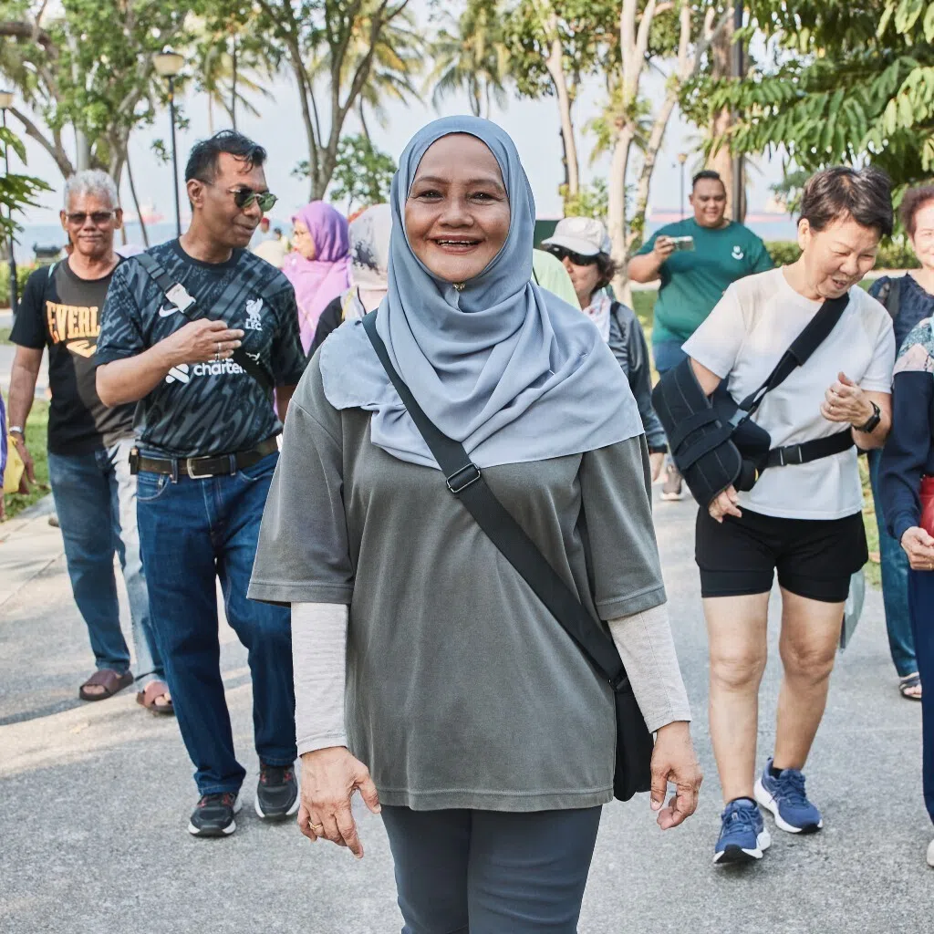 Madam Safeah Bee Abul Kayum (centre) has found a community with fellow residents in Marine Parade, participating in brisk walks and other activities together. 