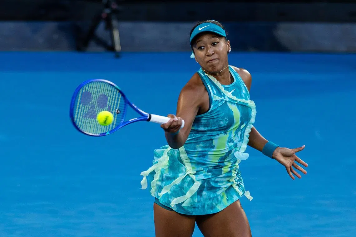 Jan 22, 2026; Melbourne, Victoria, Australia; Naomi Osaka of Japan in action against Sorana Cirstea of Romania in the second round of the women’s singles at the Australian Open at Margaret Court Arena in Melbourne Park. Mandatory Credit: Mike Frey-Imagn Images