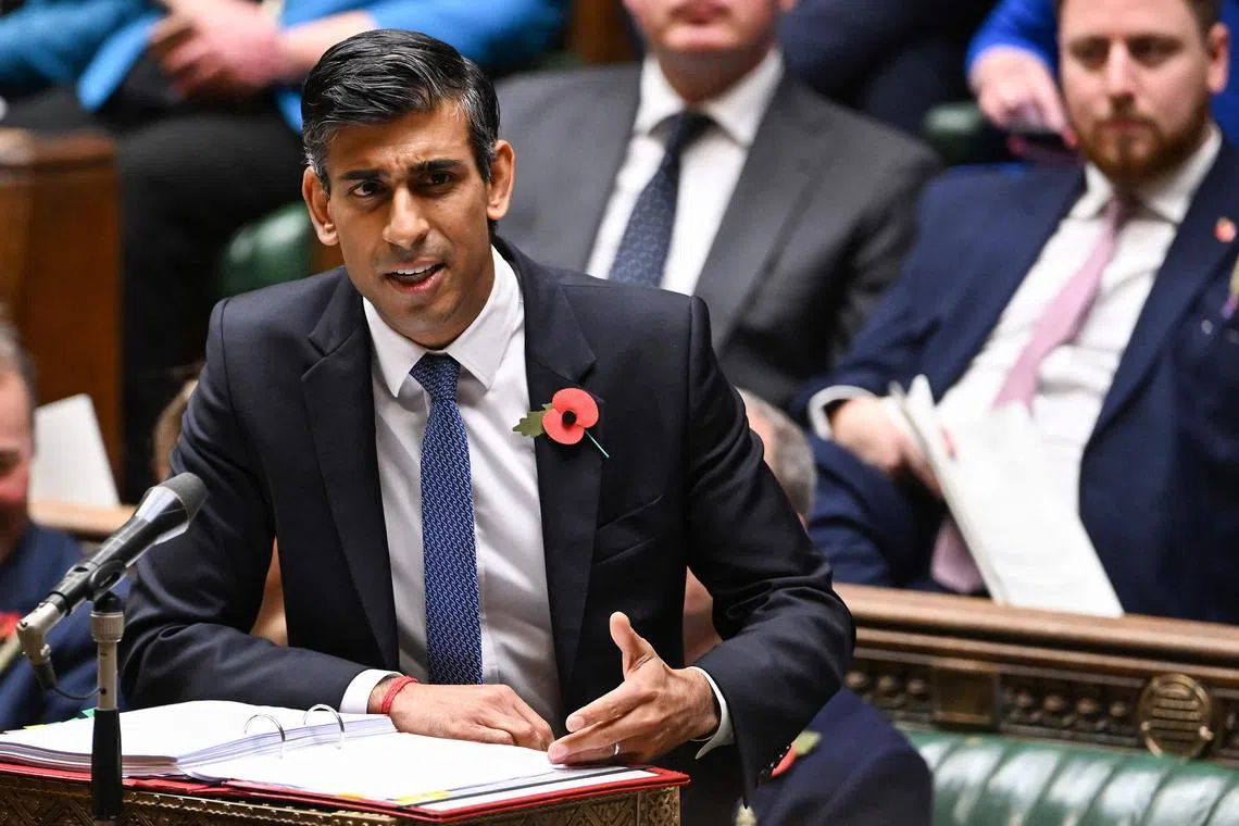 A handout photograph released by the UK Parliament shows Britain's Prime Minister Rishi Sunak speaking during Prime Minister's Questions (PMQs) in the House of Commons in London on Novermber 2, 2022. 