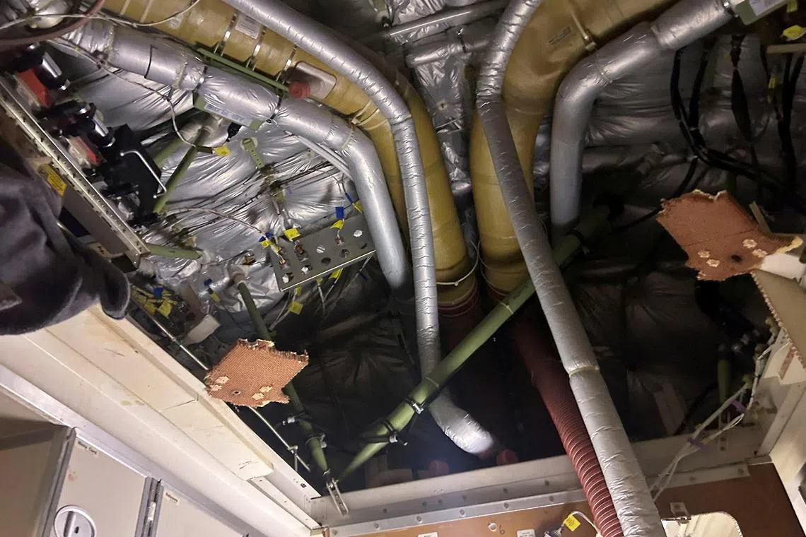 The interior of Singapore Airlines flight SQ321 is pictured after an emergency landing at Bangkok's Suvarnabhumi International Airport, Thailand.