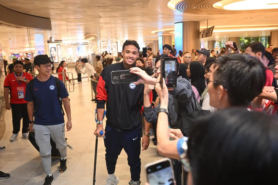 Ilhan Fandi arriving at Changi Airport with the Lions on Nov 19 after securing historic Asian Cup qualification in Hong Kong. 