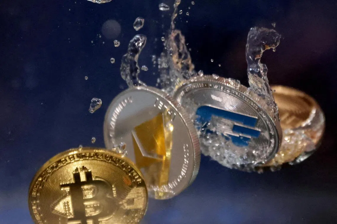 FILE PHOTO: Representations of cryptocurrency Bitcoin, Ethereum and Dash plunge into water in this illustration taken, May 23, 2022. REUTERS/Dado Ruvic/Illustration/File Photo