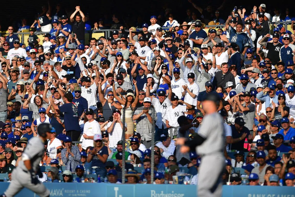 Jun 4, 2023; Los Angeles, California, USA; New York Yankees fans cheer after left fielder Oswaldo Cabrera (95) hits a ground out RBI against the Los Angeles Dodgers during the eighth inning at Dodger Stadium. Mandatory Credit: Gary A. Vasquez-USA TODAY Sports/File Photo