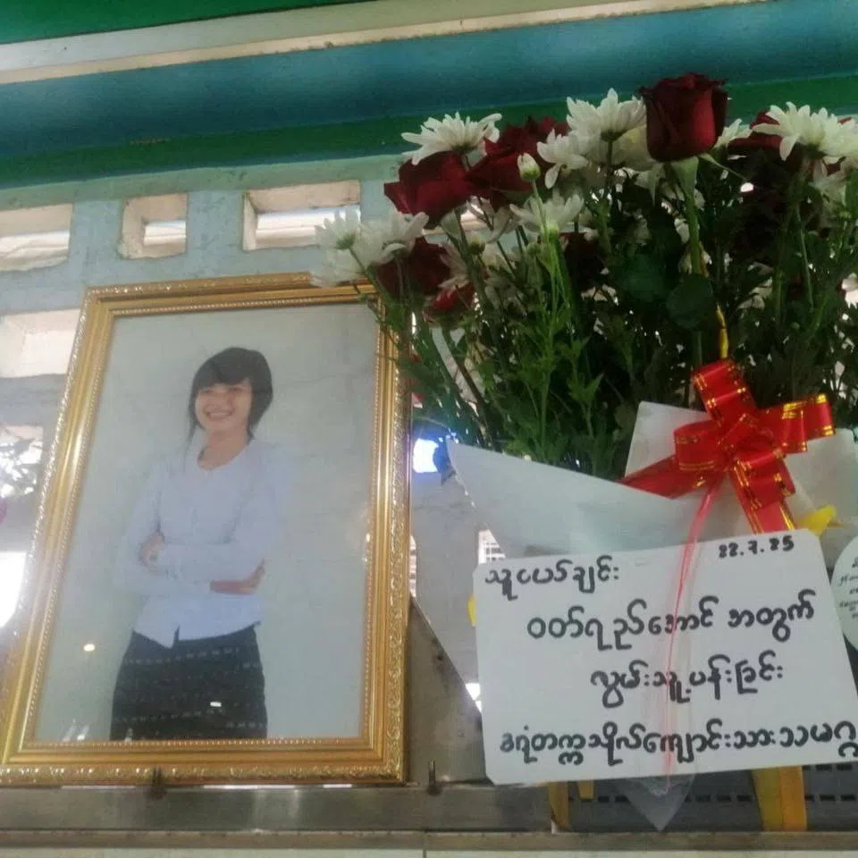 A picture of Wutt Yee Aung, a Myanmar student protester who died in prison in July 2025, is placed next to flowers at her funeral, in an undisclosed location, in Myanmar in this handout image released on July 22, 2025. Dagon University Students Union/Handout via REUTERS