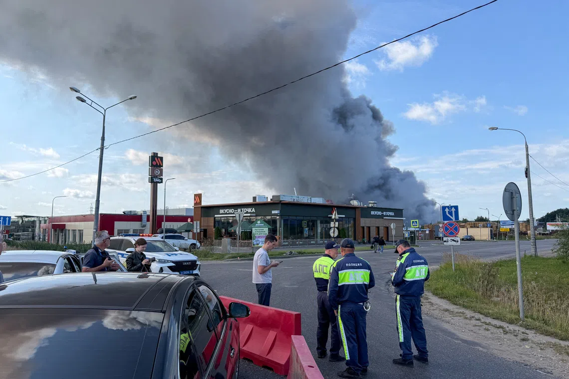 Smoke billows from the burning Wildberries warehouses following a Ukrainian drone attack, according to the regional governor, in the course of the Russia-Ukraine conflict, in Koledino, Moscow Region, Russia August 16, 2026. Picture taken with mobile phone. REUTERS/Stringer