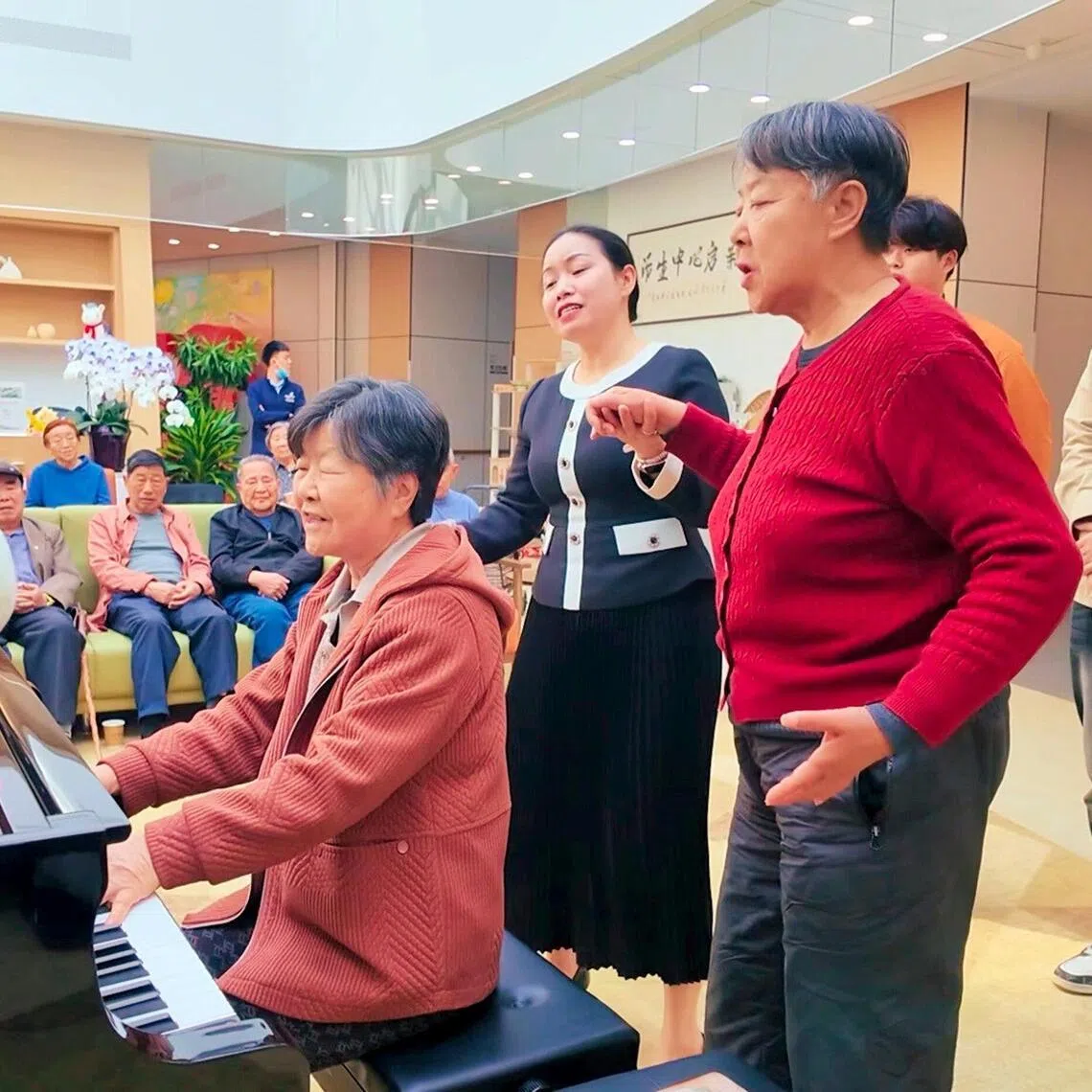 Residents and staff at Sindora Living’s senior living facility in Jinan. The 530-bed facility offers a range of activities, including literary salons and excursions.