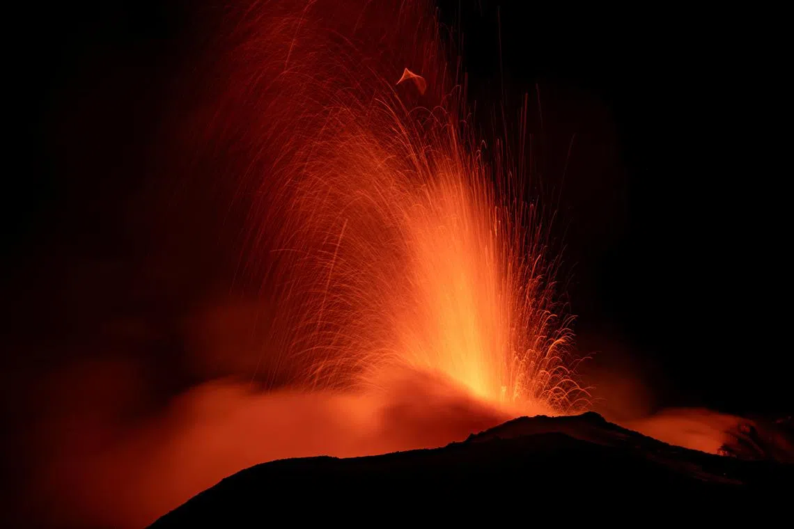 Mount Etna, Europe's most active volcano, lights up the night sky with eruptions as seen from Rocca Della Valle, Italy, August 13, 2023. Etna Walk/Marco Restivo/ Handout via REUTERS ATTENTION EDITORS - THIS IMAGE HAS BEEN SUPPLIED BY A THIRD PARTY.      TPX IMAGES OF THE DAY     