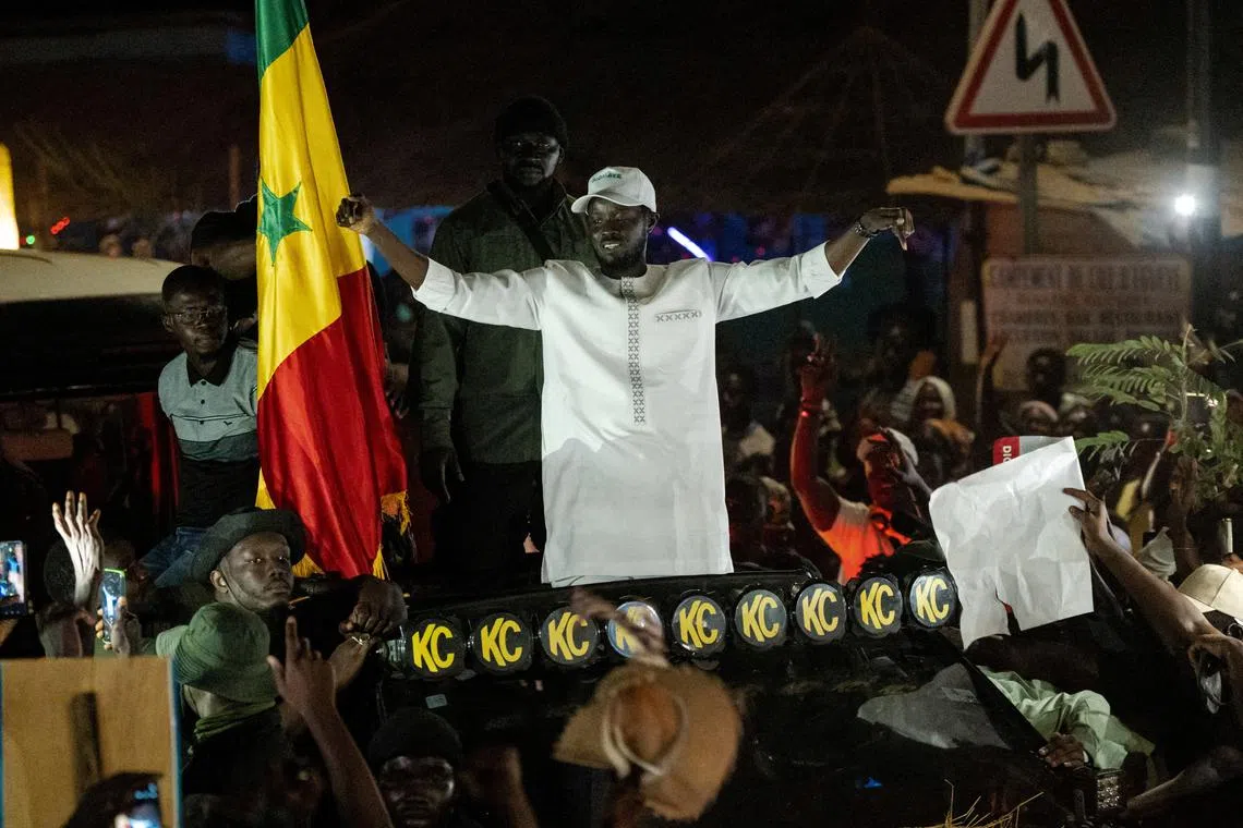 FILE PHOTO: Presidential candidate Bassirou Diomaye Faye cheers on supporters during his electoral campaign caravan in Zinguinchor, Casmance, Senegal March 16, 2024. REUTERS/Abdou Karim Ndoye/File Photo