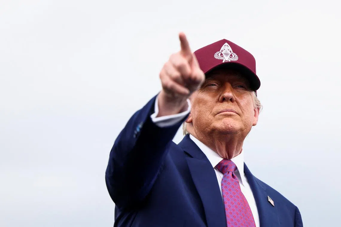 FILE PHOTO: U.S. President Donald Trump points a finger as he delivers remarks during a rally in Fort Bragg, North Carolina, U.S., June 10, 2025. REUTERS/Evelyn Hockstein/File Photo