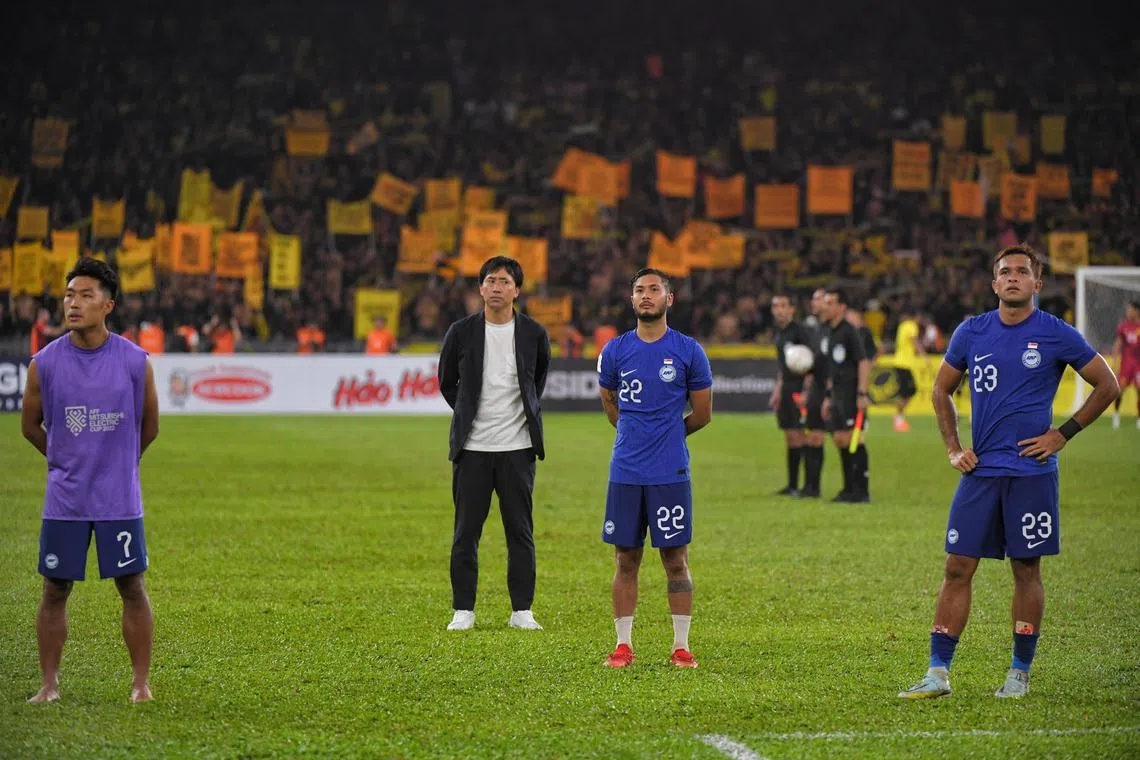 Singapore head coach Takayuki Nishigaya (centre) thanks travelling Singaporean fans after their loss to Malaysia during the AFF Mitsubishi Electric Cup match aat Bukit Jalil Stadium on January 3, 2023.
