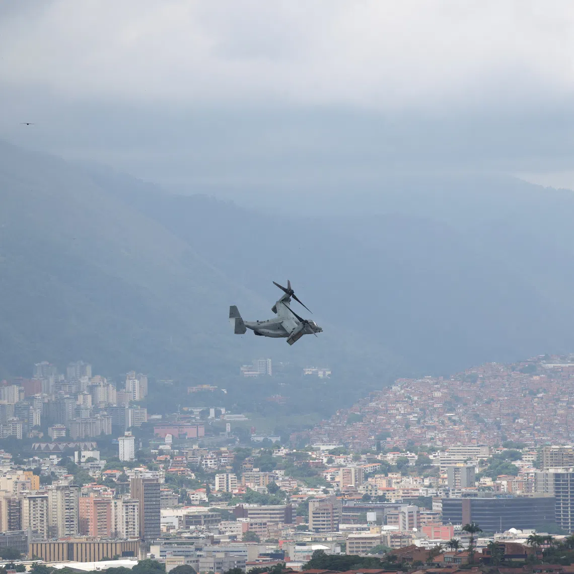 FILE PHOTO: A U.S. Marine Corps MV-22B Osprey aircraft flies away from the U.S. embassy and overflies the city during a military exercise, in Caracas, Venezuela, May 23, 2026. REUTERS/Leonardo Fernandez Viloria/File Photo
