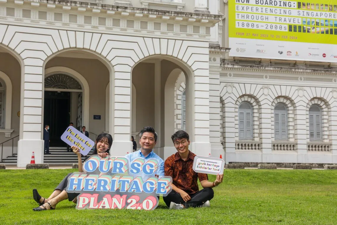 National Heritage Board's youth panel members Phoebe Pang (left) and Ng Wee Liang (right), with the board's deputy chief executive for policy and community Alvin Tan, at the launch of the kickstarter fund on Oct 26.