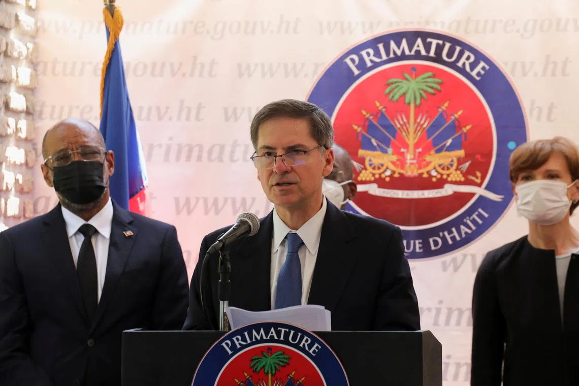 FILE PHOTO: World Bank Vice-President for the Latin America and the Caribbean Region Carlos Felipe Jaramillo addresses the audience next to Haiti's Prime Minister Ariel Henry, in Port-au-Prince, Haiti May 3, 2022. REUTERS/Ralph Tedy Erol/File Photo