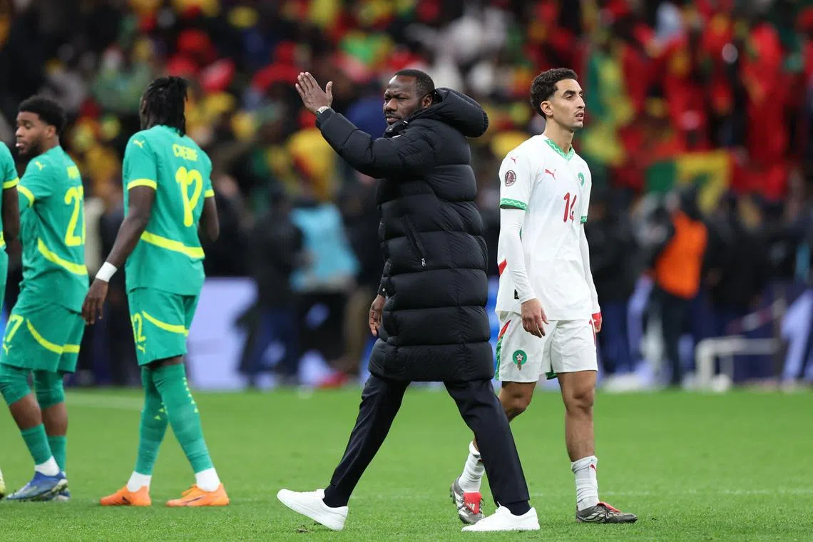 FILE PHOTO: Soccer Football - CAF Africa Cup of Nations - Morocco 2025 - Final - Senegal v Morocco - Prince Moulay Abdellah Stadium, Rabat, Morocco - January 18, 2026 Senegal coach Pape Thiaw gestures for his players to leave the pitch after a penalty is awarded to Morocco REUTERS/Amr Abdallah Dalsh/ File Photo