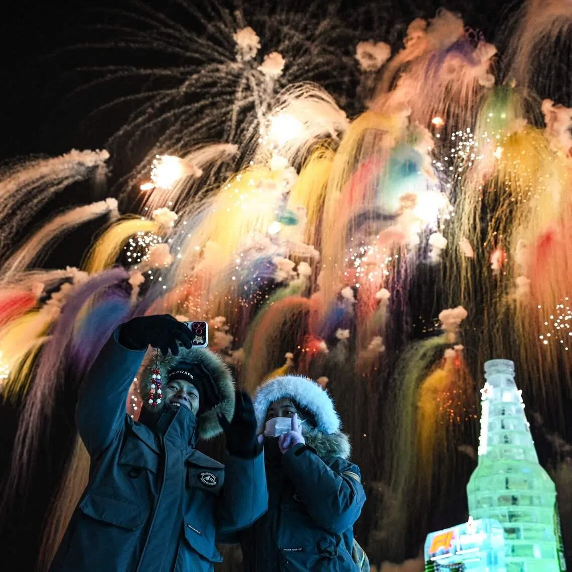 Visitors enjoying the fireworks during the opening ceremony of the 42nd Harbin China International Ice and Snow Festival at Harbin in northeastern Chinas Heilongjiang province on Jan 5, 2026. 