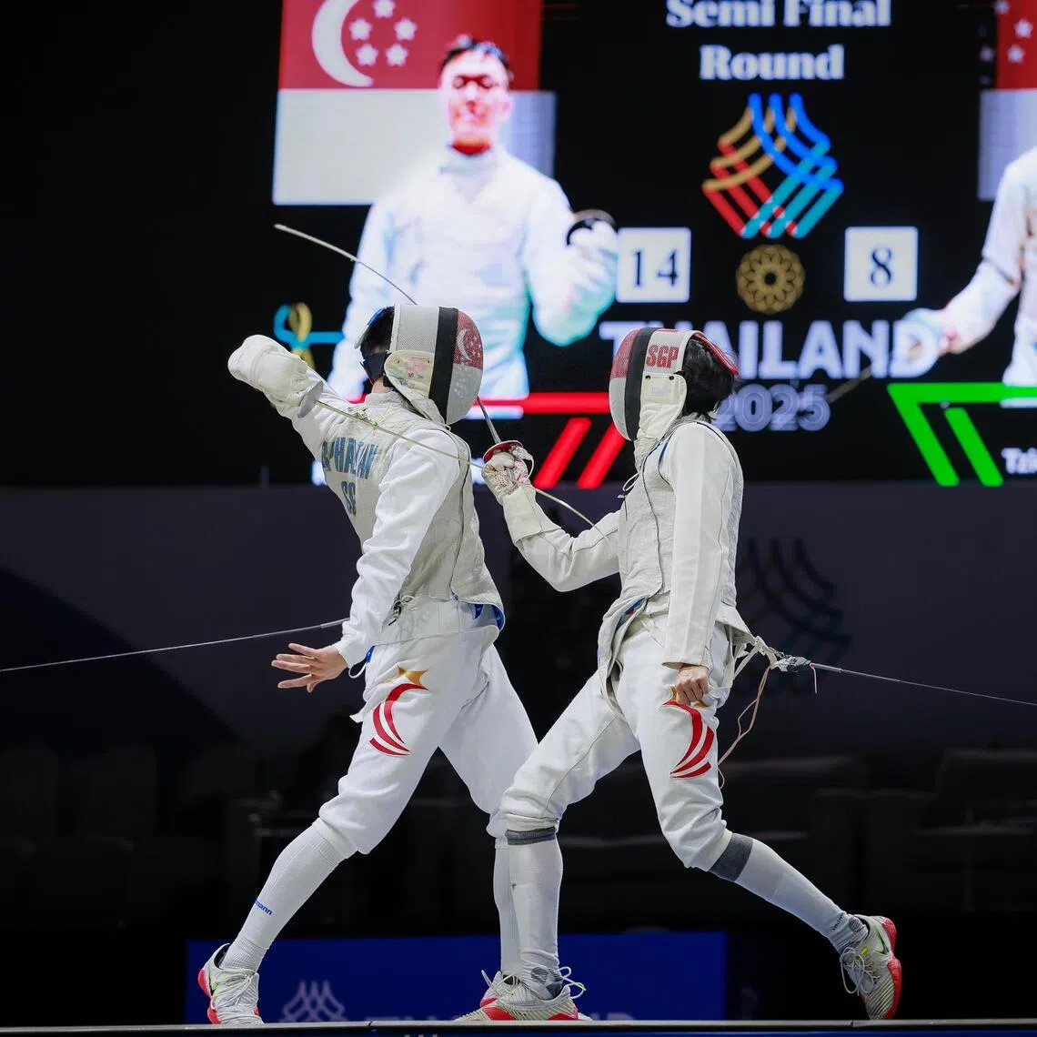 Raphael Tan (left) beat teammate Jonathan Lim in the men's individual foil semi-final before going on to win gold.